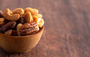 Honey Roasted Nuts on a Rustic Dark Wood Table