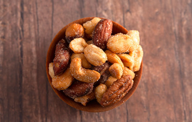Honey Roasted Nuts on a Rustic Dark Wood Table