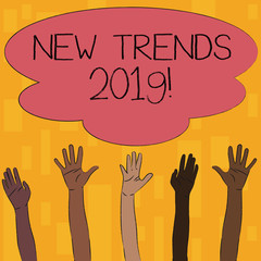 Text sign showing New Trends 2019. Business photo text general direction in which something is developing Multiracial Diversity Hands Raising Upward Reaching for Colorful Big Cloud