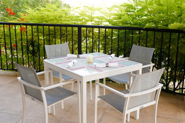 dining table set up in open terrace with beautiful nature view