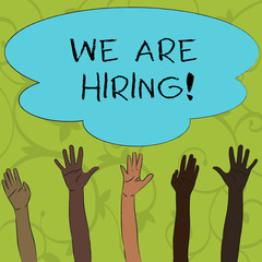 Writing note showing We Are Hiring. Business concept for recently employ someone or pay him to do particular job Multiracial Hands Raising Up Reaching for Colorful Big Cloud