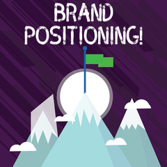 Word writing text Brand Positioning. Business photo showcasing creating a unique impression in the minds of the customers Three High Mountains with Snow and One has Blank Colorful Flag at the Peak