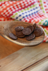 Chocolate melting wafers on a spoon 
