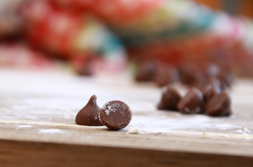 Chocolate chips sitting on a counter 