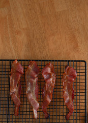 Bacon sitting on a cooling rack 