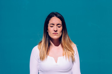 Portrait of independent young woman with serious, thoughtful and worried face.