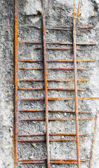 Rusted girders in eroded concrete.
