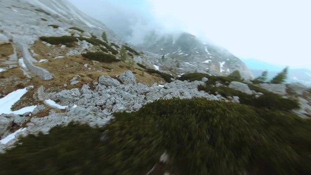 Low Flight Around Mountain Slope in Val Parola Dolomite. Drone FPV Freestyle Shot.