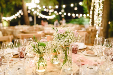 Floral arrangements for empty chairs for a wedding ceremony in spring