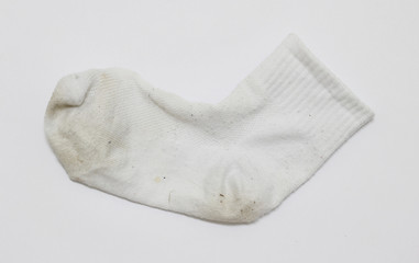 Old dirty socks on white paper background