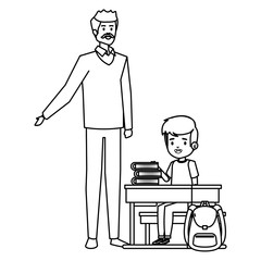 student boy seated in school desk with male teacher