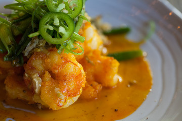 Close up of spicy shrimp with jalapeños  