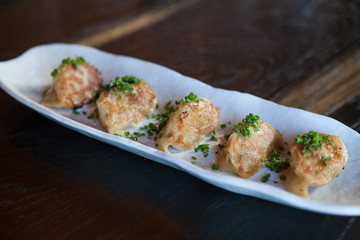 Close up of pan fried wontons dim sum