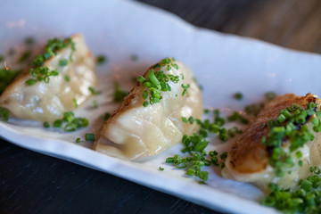 Close up of pan fried wontons dim sum