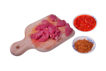 Appetizing red fresh veal, sliced into raw thin beef, chili and coconut fried or Kerisik  isolated   on white background