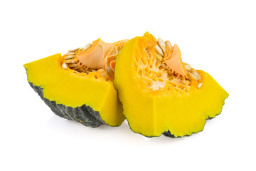 cut fresh pumpkins with seeds on white background