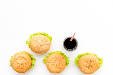 National american food concept with burgers on white background top view