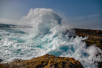 waves crashing on rocks