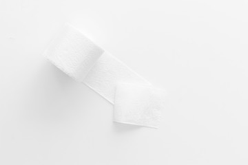 Toilet paper roll on white background top view