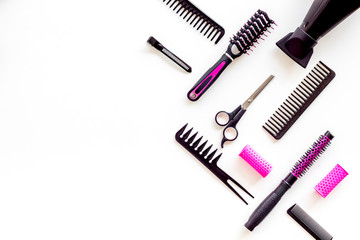 Hairdresser equipment for cutting hair and styling with combs, sciccors, brushes on white background top view copyspace