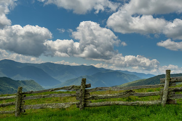 Wooden Fence Along Mountain Field