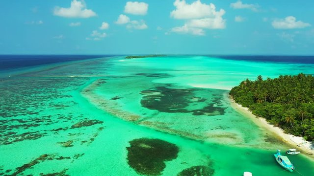 Beautiful Tropical Island in the Bahamas, Boats in the Sea, Saltwater all Around the Isle, Blue Sky, Drone Video