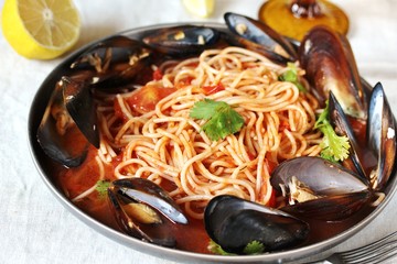 Pasta Spaghetti with mussels, tomato sauce. sea food meal. Mussels Marinara. Typical dish of Italian pasta.