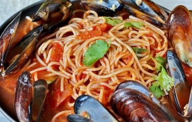 Pasta Spaghetti with mussels, tomato sauce. sea food meal. Mussels Marinara. Typical dish of Italian pasta.