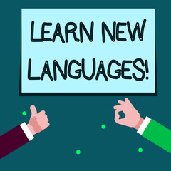 Word writing text Learn New Languages. Business photo showcasing developing ability to communicate in foreign lang Two Businessmen Hands Gesturing the Thumbs Up and Okay Sign for Promotion
