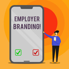 Word writing text Employer Branding. Business photo showcasing promoting company employer choice to desired target group Man Presenting Huge Blank Screen Smartphone while Holding Another Mobile