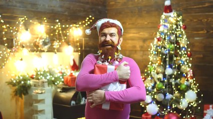 Gift emotions. Christmas Santa wishes merry Christmas. Hipster modern Santa Claus wishes Merry Christmas. Merry Christmas and happy New year.