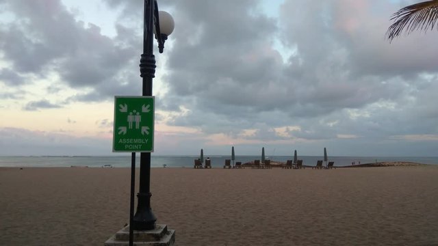 Meeting or assembly point sign on the beach near Kuta beach Bali