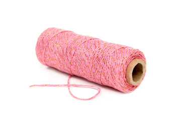 spool of twine pink with gold shimmer