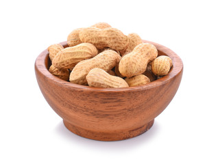 peanuts in wooden bowl on white background.