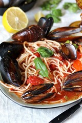 Mussels Marinara Pasta Spaghetti with  tomato sauce. sea food meal. Typical dish of Italian pasta.