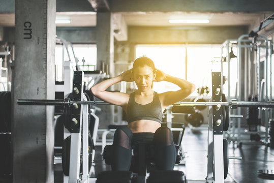 Fit Asian Woman Doing Situp Or Crunches In Gym,Female Exercise Muscular Stomach