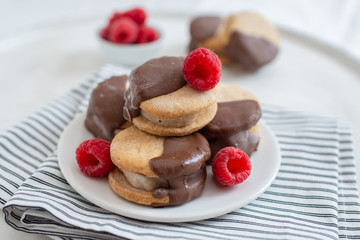 Sweet delicious ice cream cookie sandwiches on table