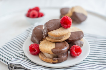 Sweet delicious ice cream cookie sandwiches on table