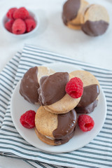 Sweet delicious ice cream cookie sandwiches on table