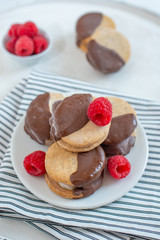 Sweet delicious ice cream cookie sandwiches on table