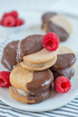 Sweet delicious ice cream cookie sandwiches on table