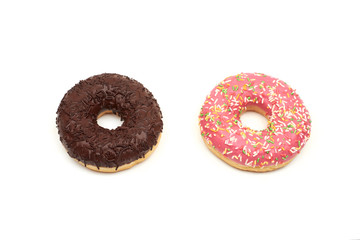 Tasty chocolate donut and Pink donut with colorful sprinkles on white background
