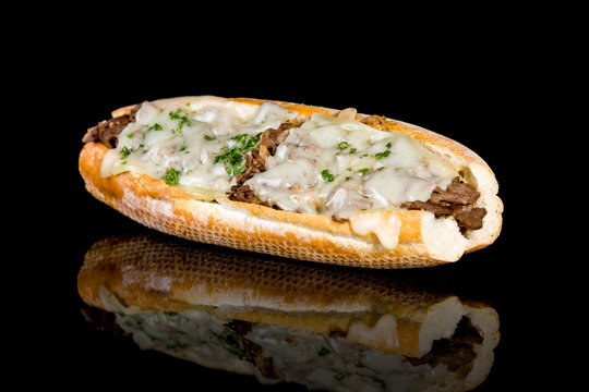 PHILLY CHEESE STEAK with reflection isolated on black background