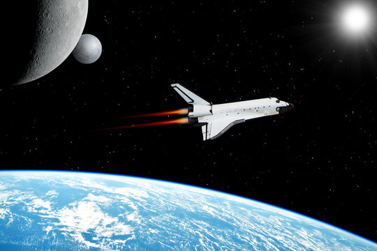 Space shuttle orbiting in  a space over the earth planet and starry background. Elements of this image furnished by NASA.