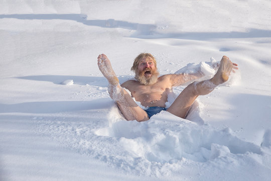 Bearded man, after bathing in the snow