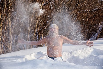Bearded man, after bathing in the snow