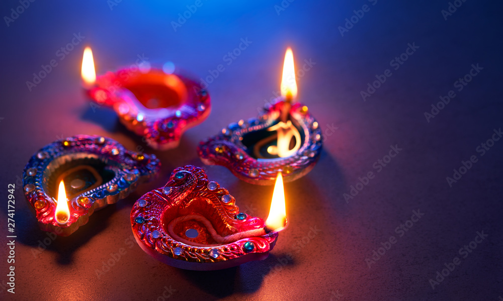 Wall mural Diya lamps lit during diwali celebration