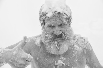 Bearded man, after bathing in the snow