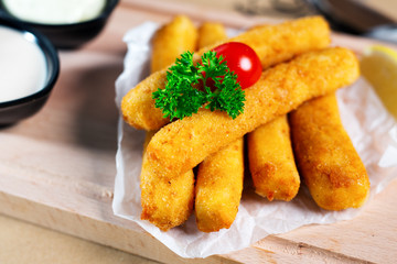 Croquettes on a wood plate with fork