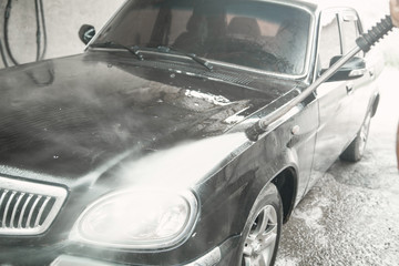 Car washing. The washing process on a self service car wash